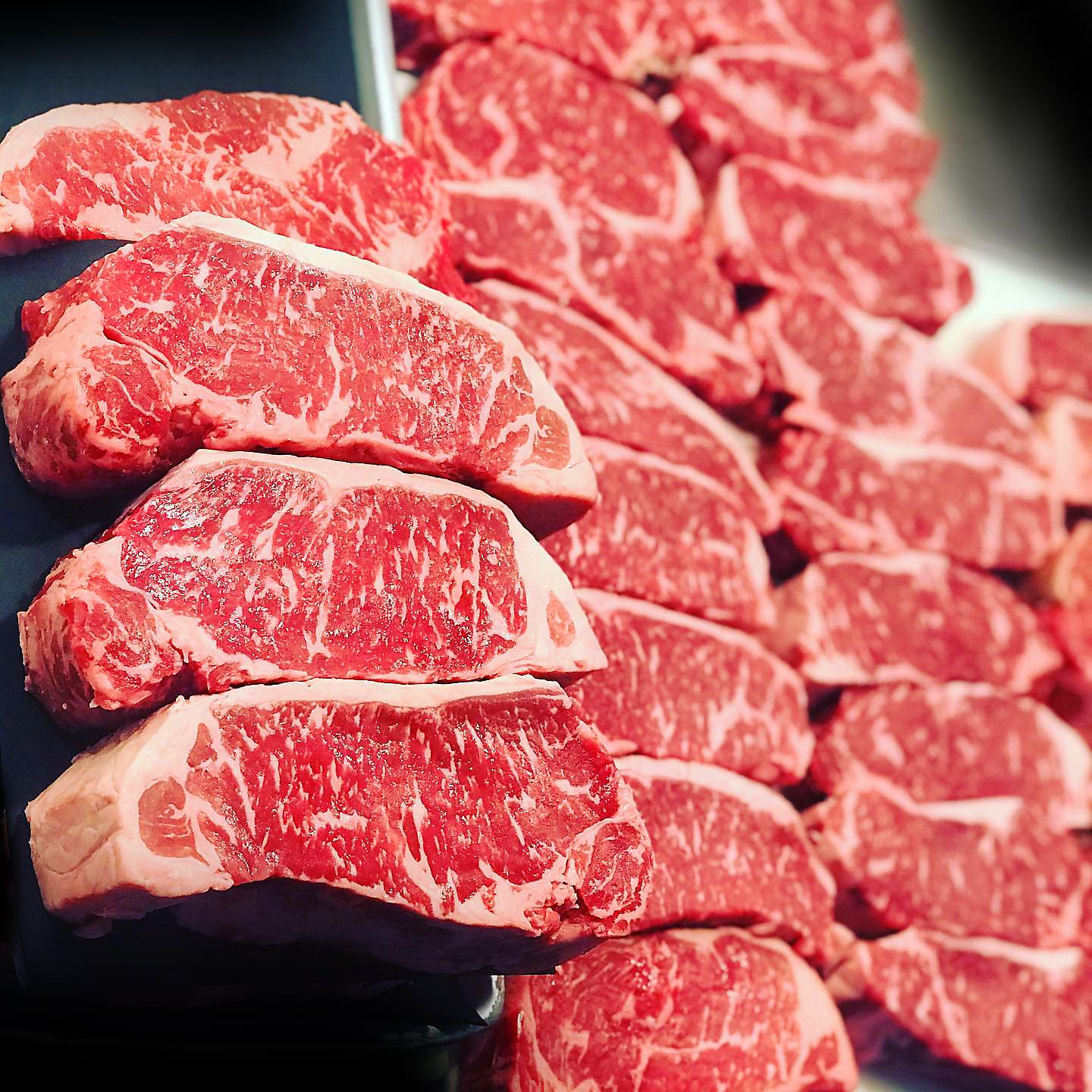 Hand-cut prime steaks ready in the display case